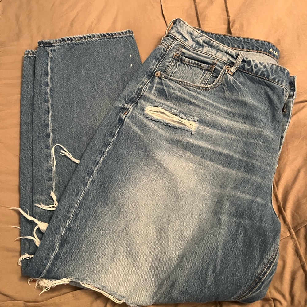 Women’s American Eagle Tomgirl Jeans. Size 16 short. Distressed holes.Buttonfly